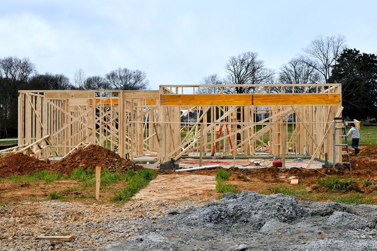 New house under construction with timber framing