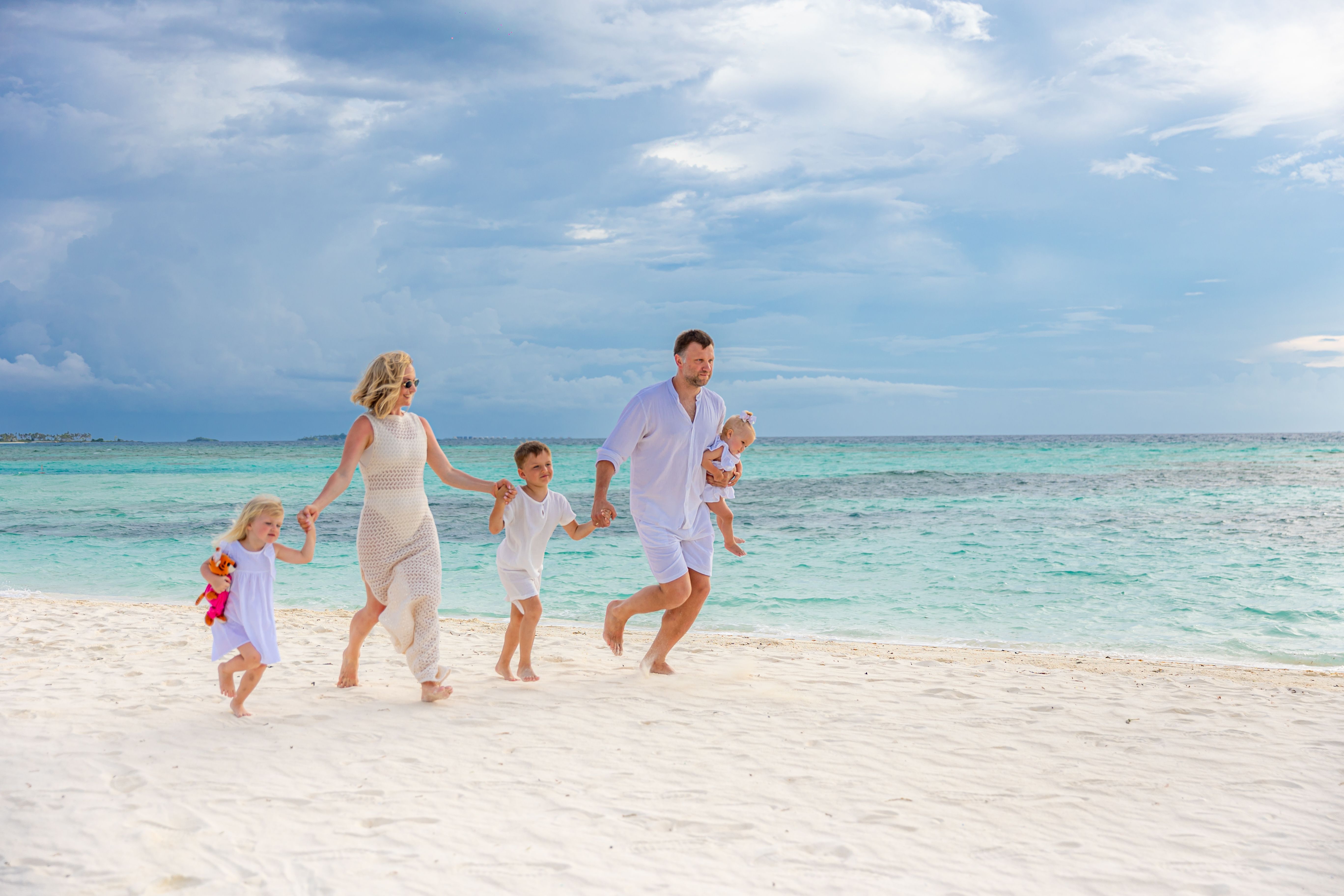 Family walking along the beach together